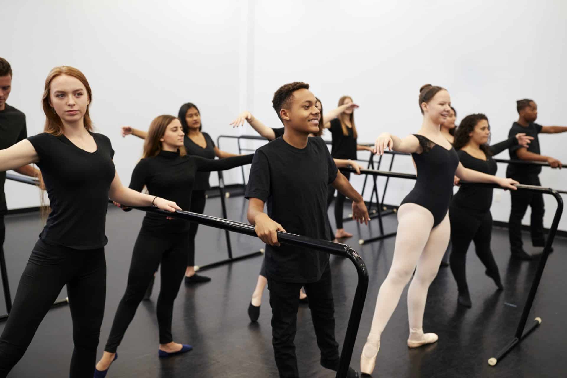 Students rehearsing in a dance studio.